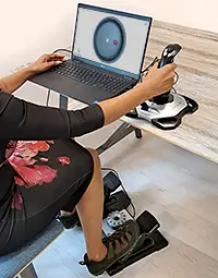 A candidate using Control and Co-Ordination with a joystick and foot pedal