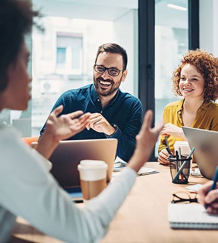 Happy colleagues talking in an office