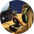 A woman flying a simulator