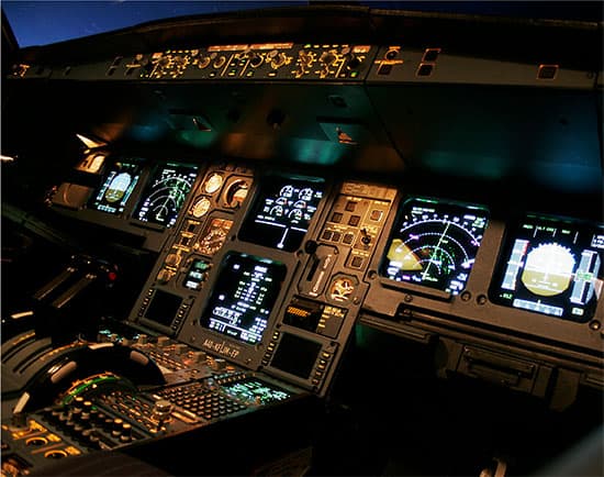 Photograph of the inside of an illuminated cockpit
