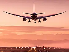 A pilot of a plane holding the controls