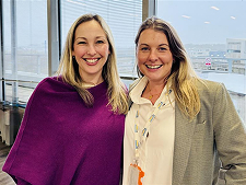 Hannah Davies, Director of Strategy & Growth at Symbiotics and Emily Hooker, Learning & Development Manager at SkyPeople Training posing for a photo