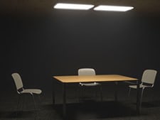 Table and chairs in a spotlight